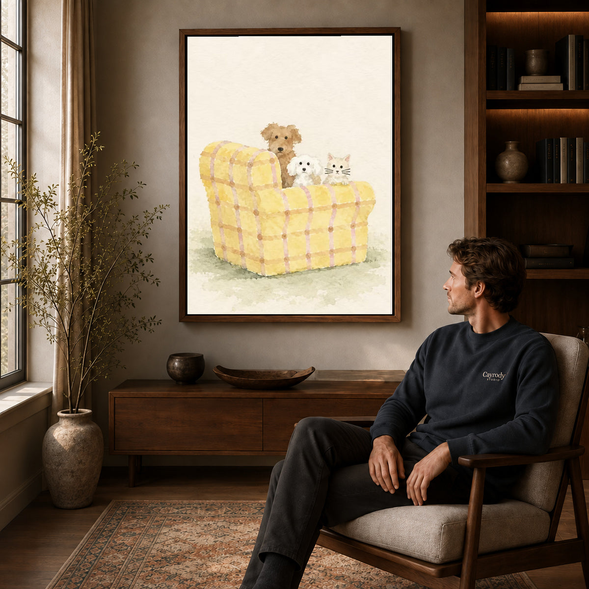 Pet sofa canvas art above a wooden console near a seated man and leafy branches.