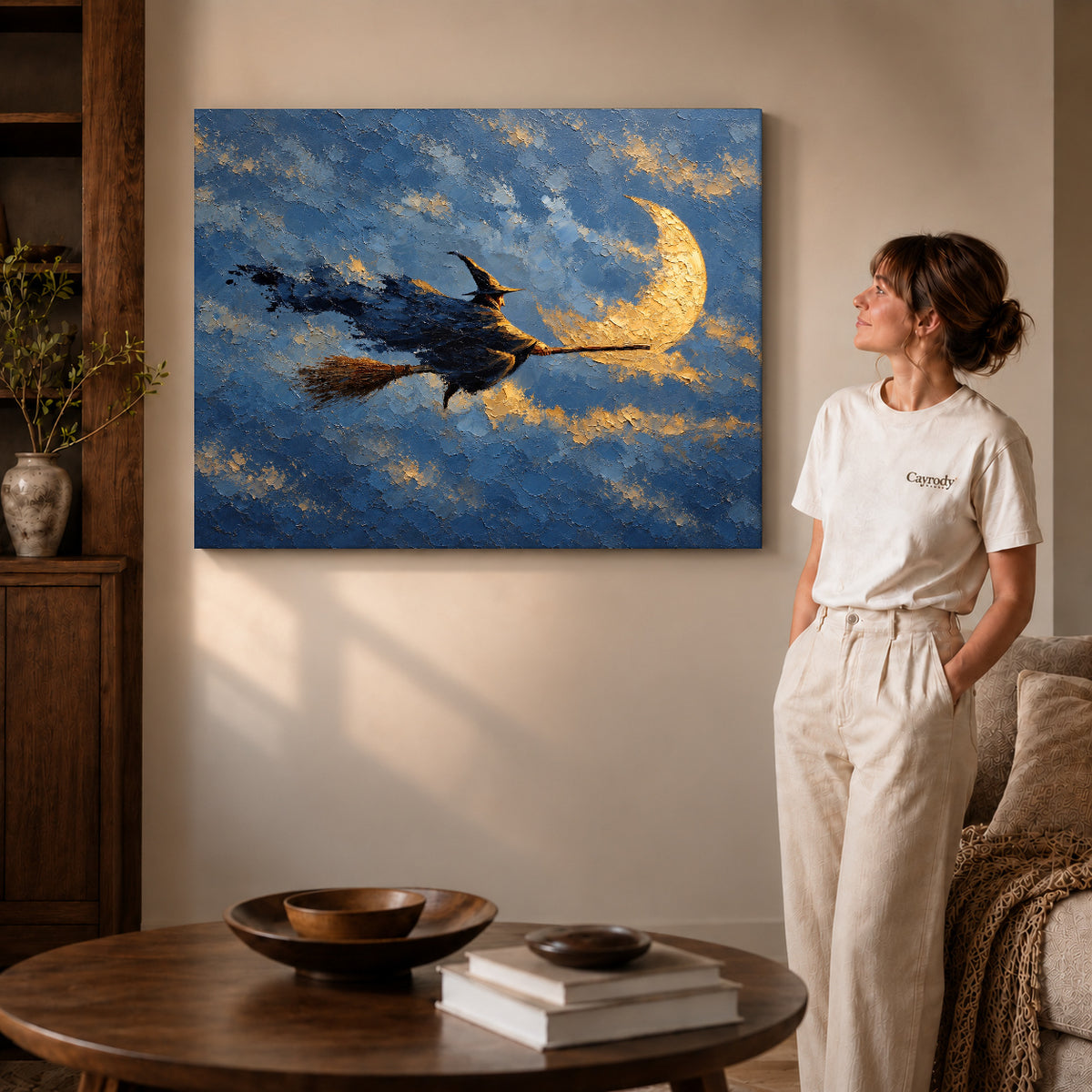 Moonlit witch canvas art on unframed wrapped canvas, showing natural edge depth against the living room wall.