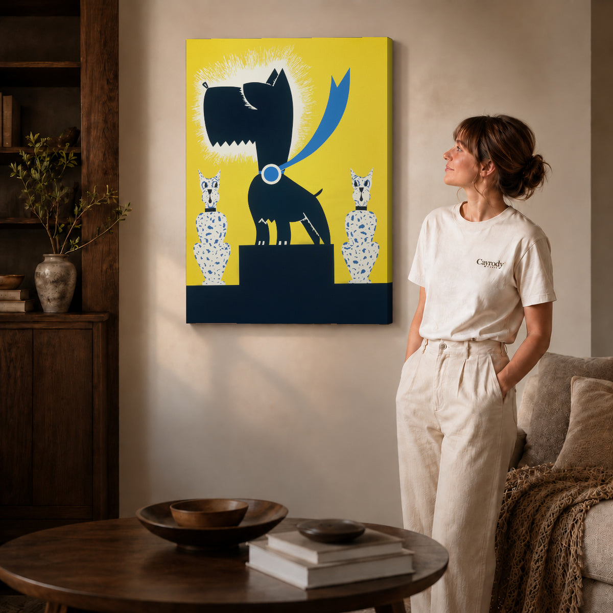 Black terrier canvas art on gallery wrapped canvas with a visible shaded side edge beside a woman.