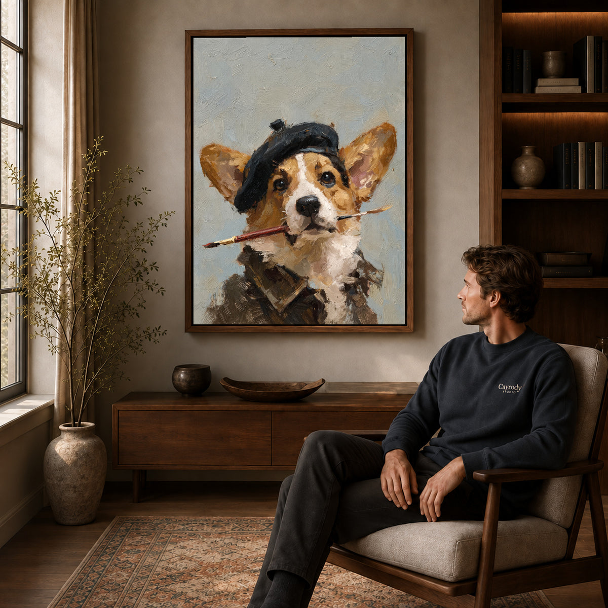 Artist corgi canvas art above a wooden console near a seated man and leafy branches.