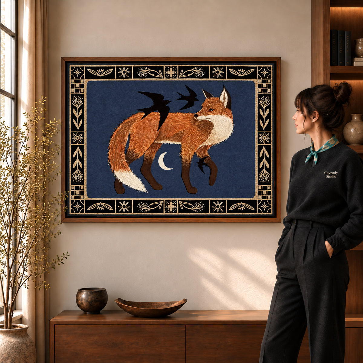 Fox and birds canvas art displayed in a walnut frame against a warm wall near a wooden console.