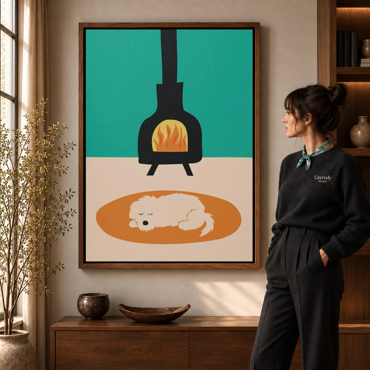 Fireplace dog canvas art in a walnut frame beside a woman in a warmly lit living room.