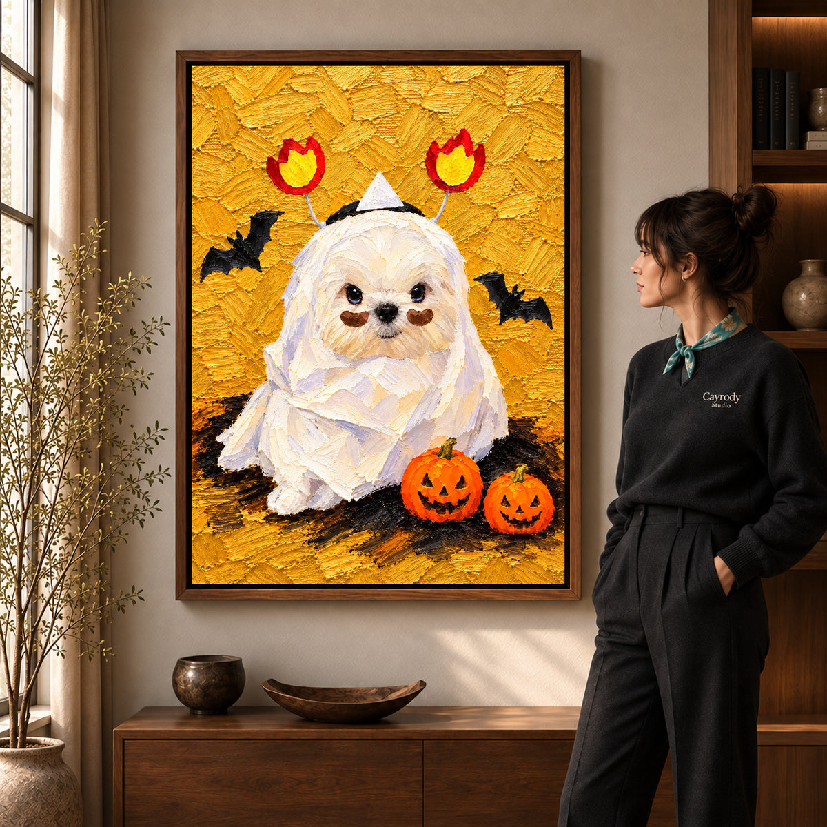 Mummy Puppy canvas art in a walnut frame beside a standing woman and wooden console.