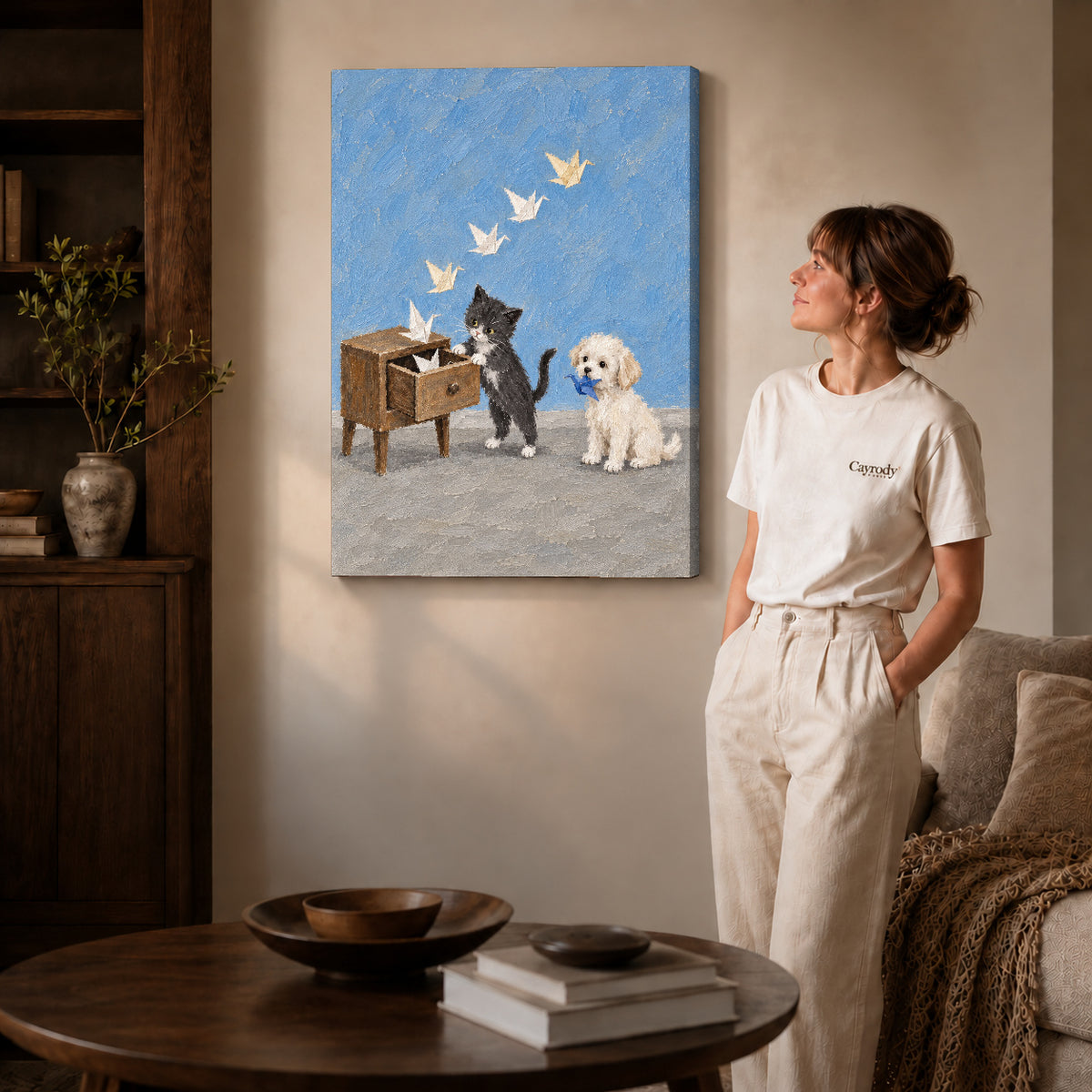Gallery wrapped paper crane pets canvas art with visible canvas edges beside a standing woman.