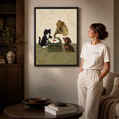 Black framed musical pets canvas art displayed beside a woman in a warm living room.