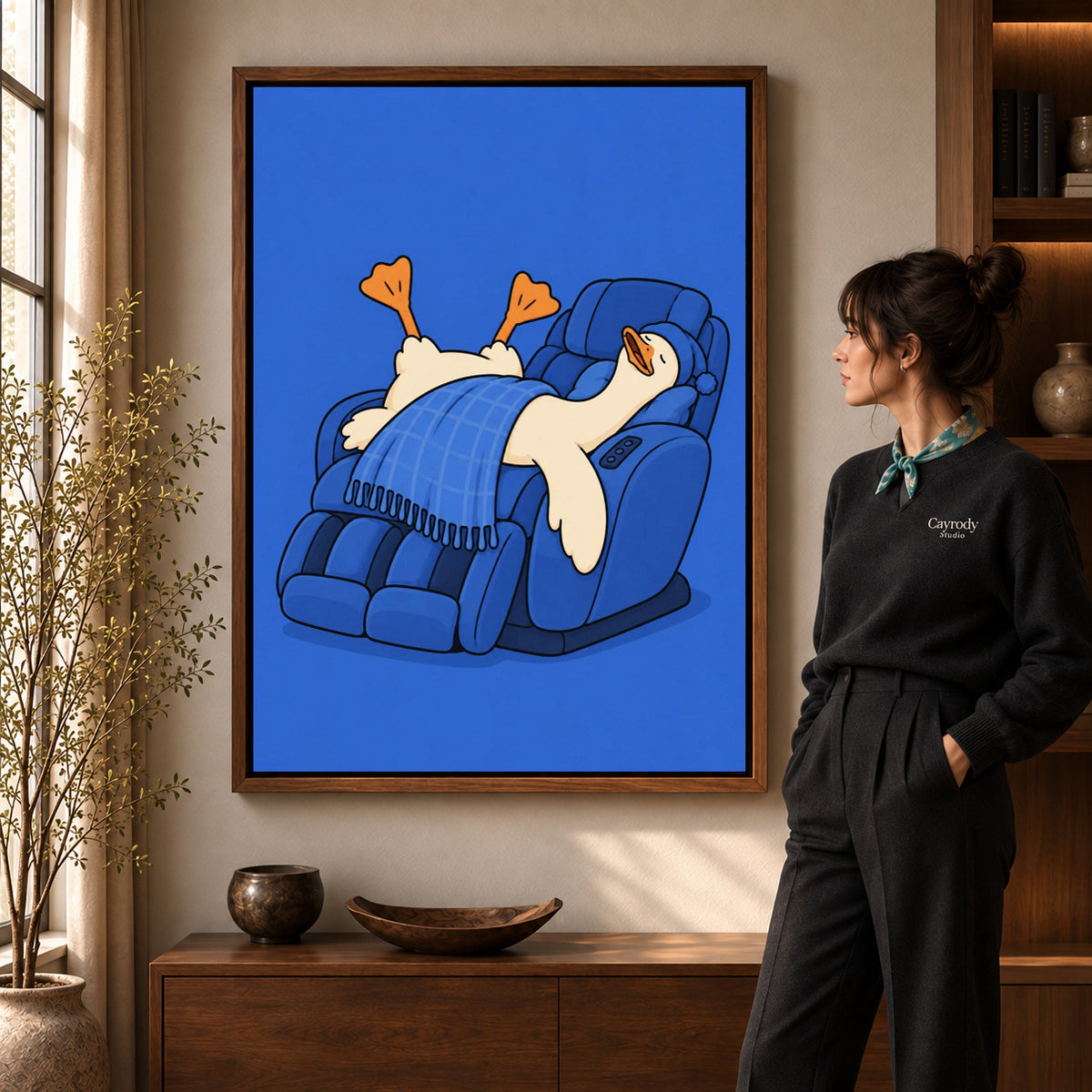 Relaxing duck canvas wall art in a walnut frame, featuring a blue recliner and sleeping white duck.