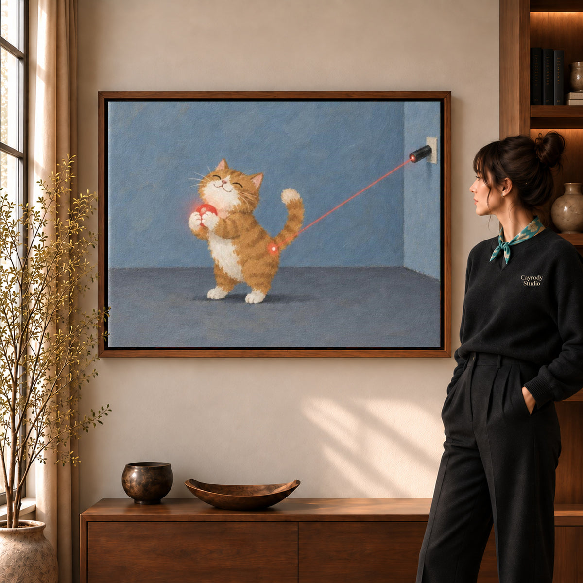 Ginger kitten canvas art displayed in a walnut frame against a warm wall near a wooden console.