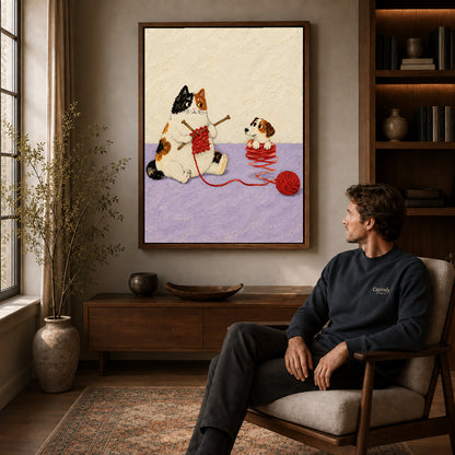 Knitting Cat canvas art above a wooden console beside a seated man in a warm room.