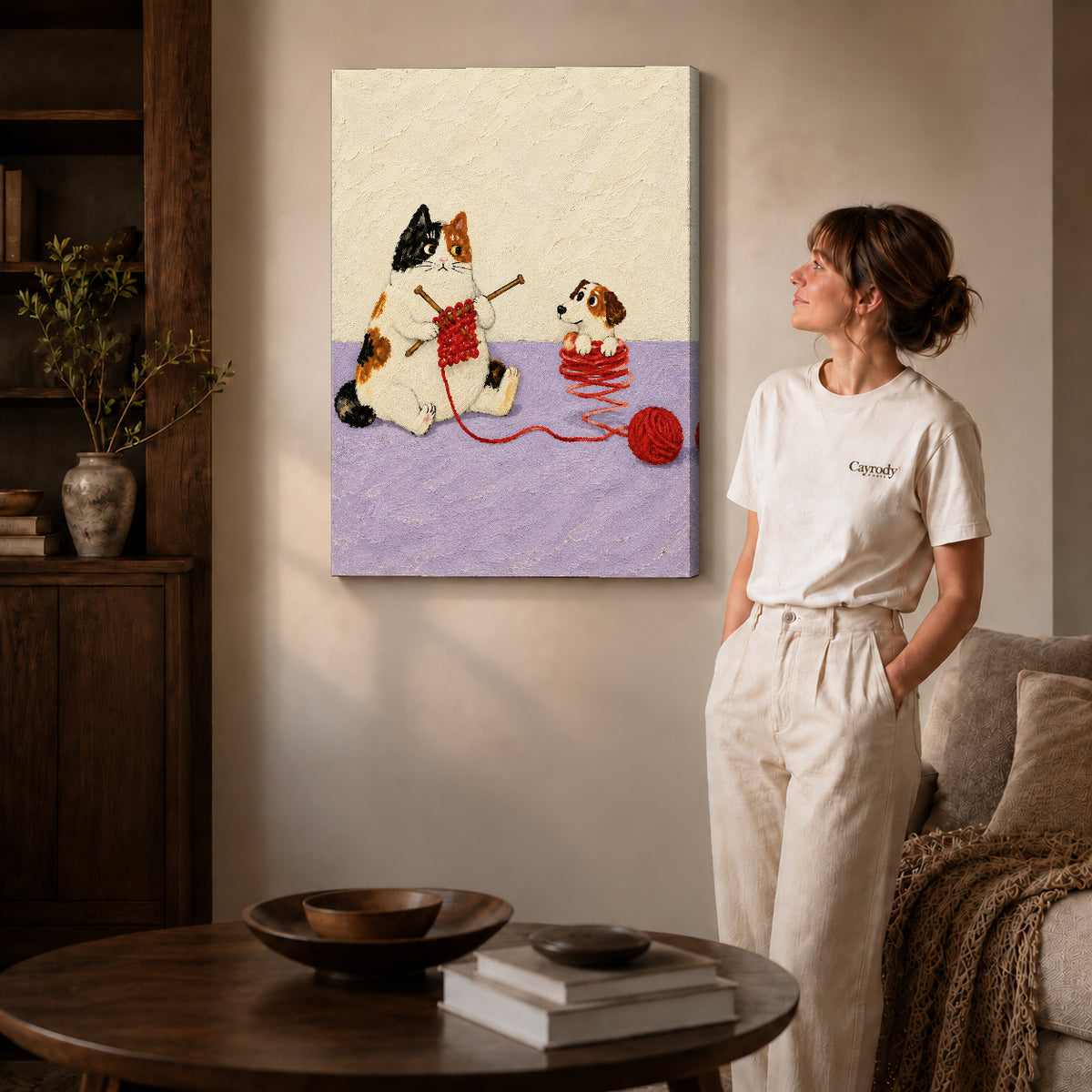 Knitting Cat canvas art displayed as gallery wrapped canvas beside a woman in natural light.