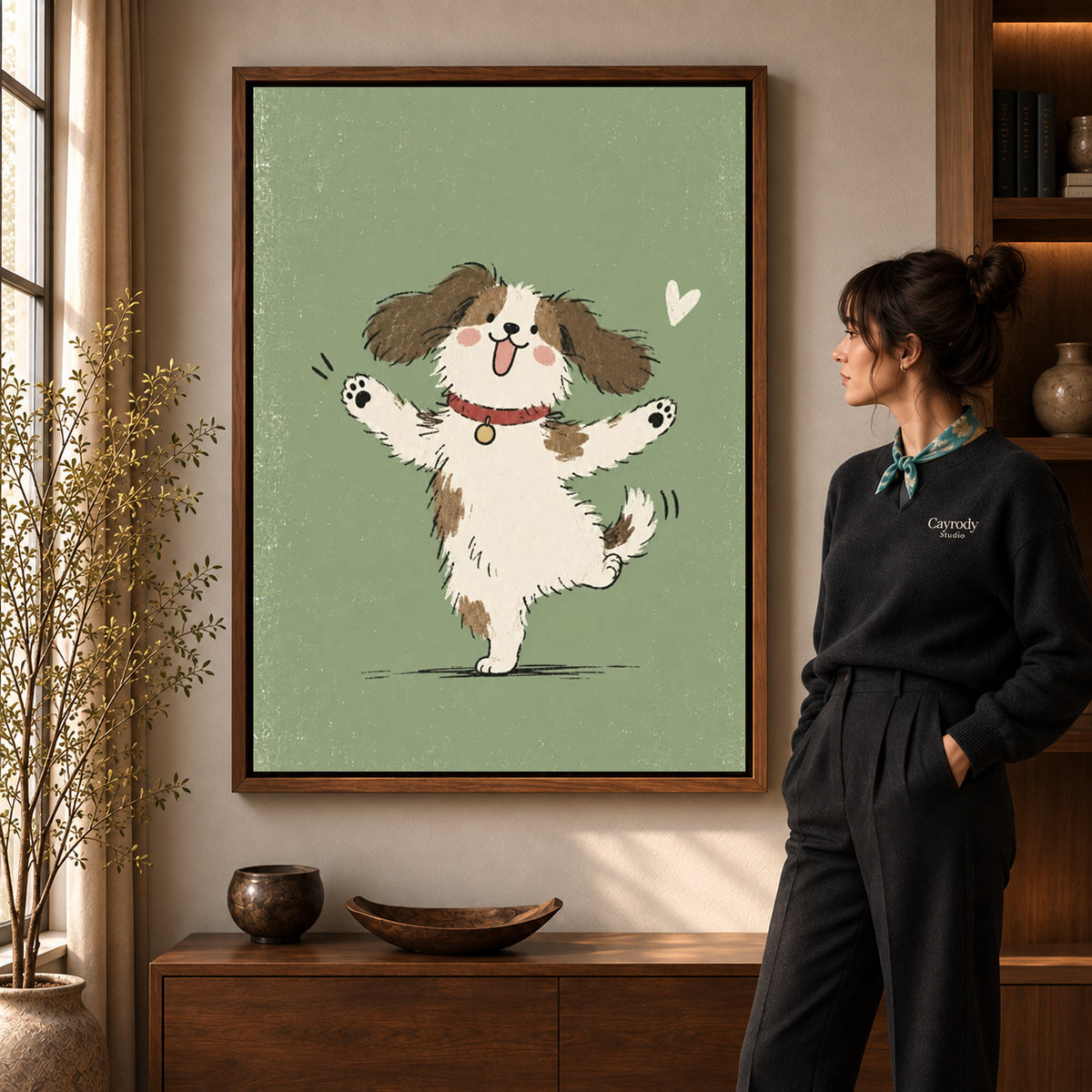 Dancing puppy canvas art displayed in a walnut frame against a warm wall near a wooden console.