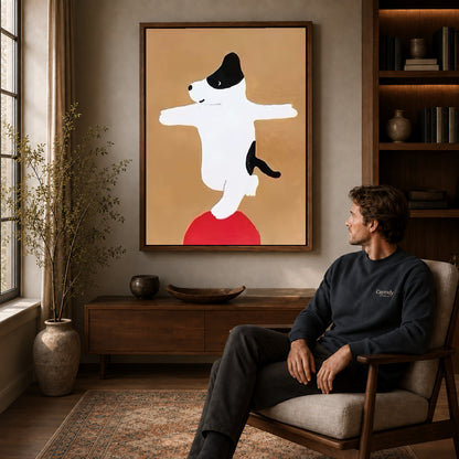 Balancing dog canvas art above a wooden console near a seated man and leafy branches.