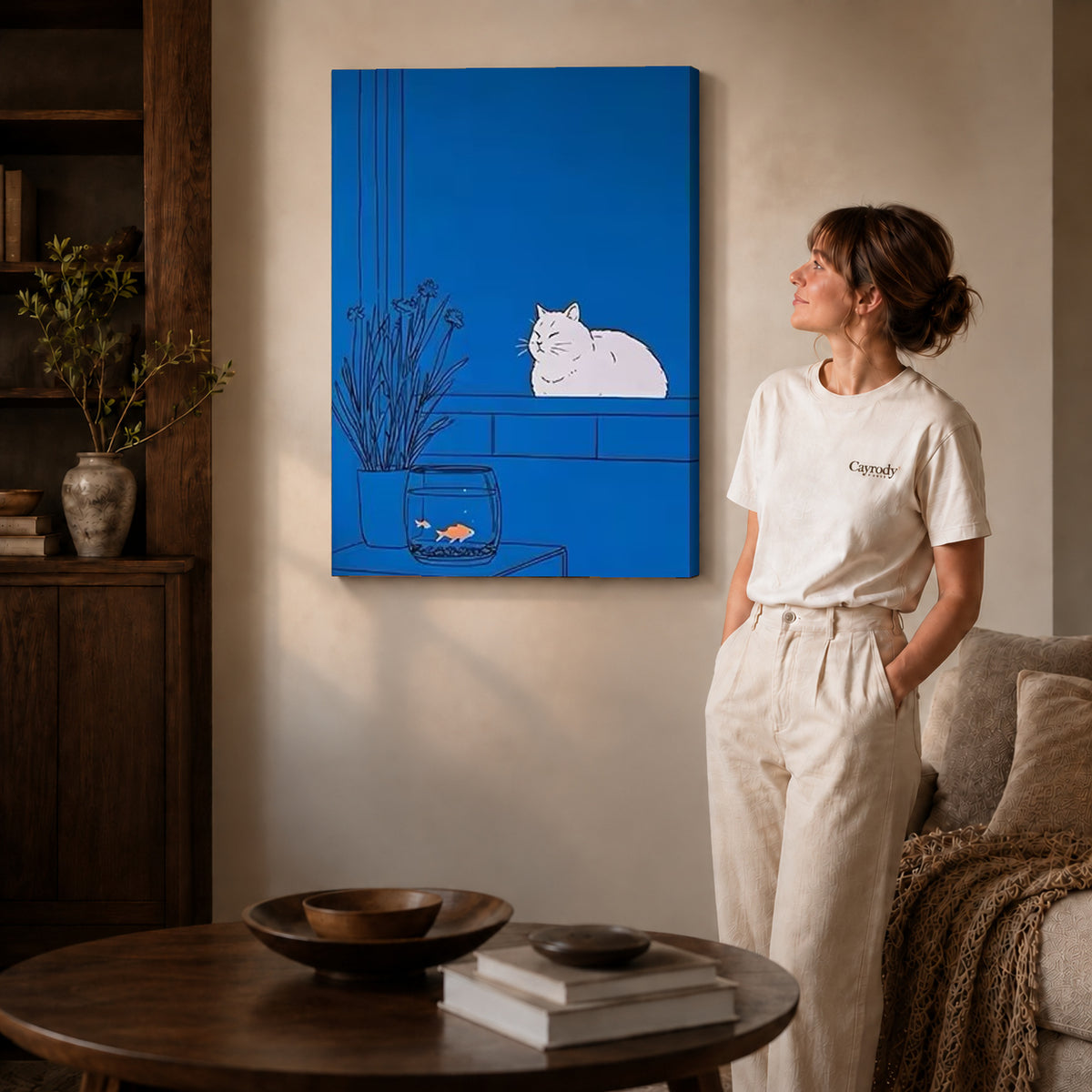 Blue cat canvas art on unframed wrapped canvas, showing natural edge depth against the living room wall.