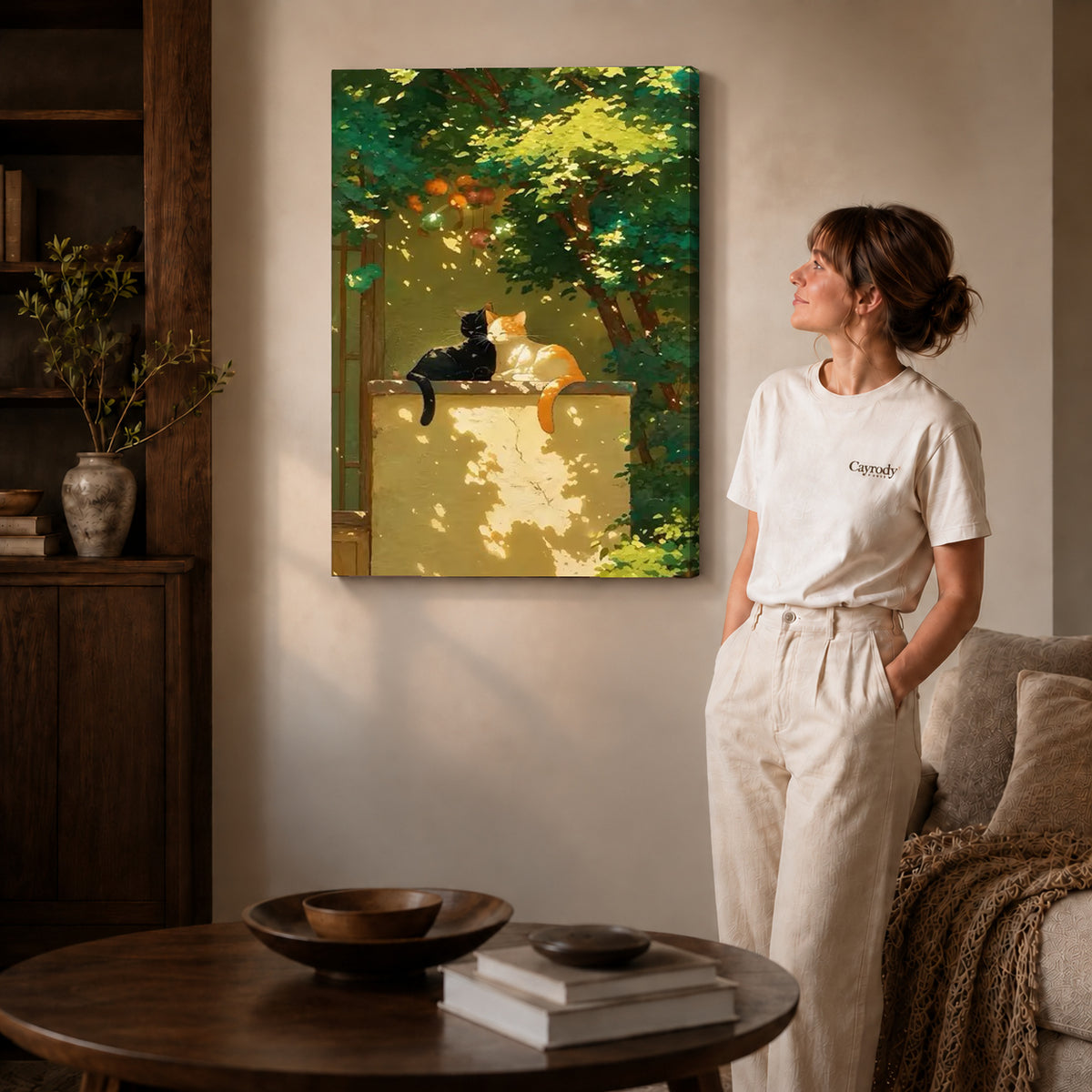 Garden cats canvas art on gallery wrapped canvas with a visible shaded side edge beside a woman.