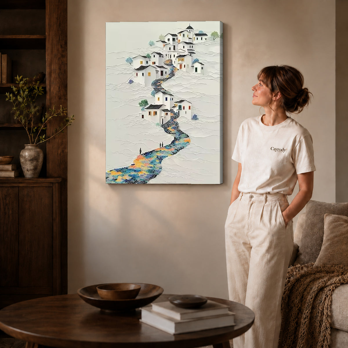 Hillside village canvas art on unframed wrapped canvas, showing natural edge depth against the living room wall.