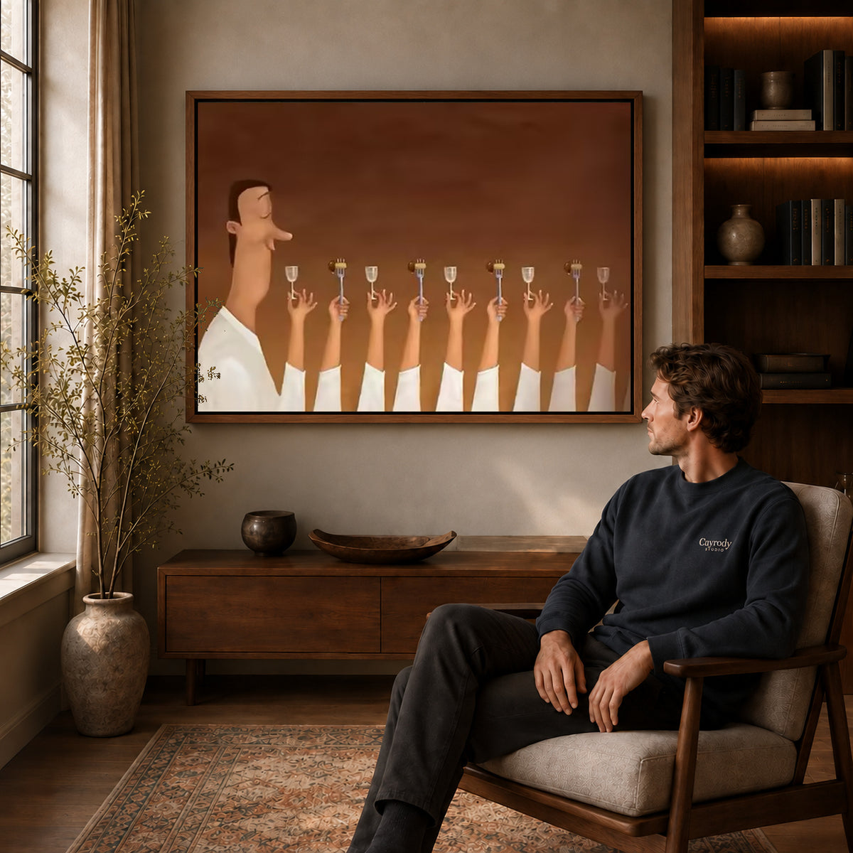 Dinner guest canvas art above a wooden console near a seated man and leafy branches.