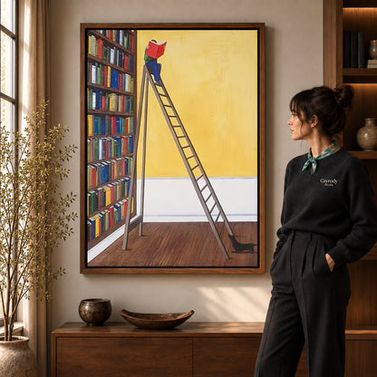 Library reader canvas art in a walnut frame beside a woman in a warmly lit living room.