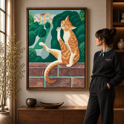 Garden tabby canvas art in a walnut frame beside a woman in a warmly lit living room.