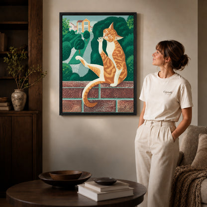 Garden tabby canvas art displayed in a black frame beside a woman, with soft room lighting.