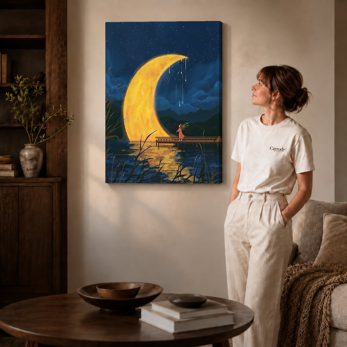 Crescent moon canvas art on gallery wrapped canvas with a visible shaded side edge beside a woman.