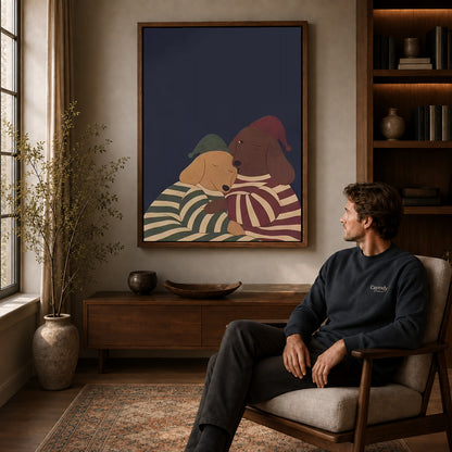 Pajama Dachshunds canvas art above a wooden console beside a seated man in a warm room.