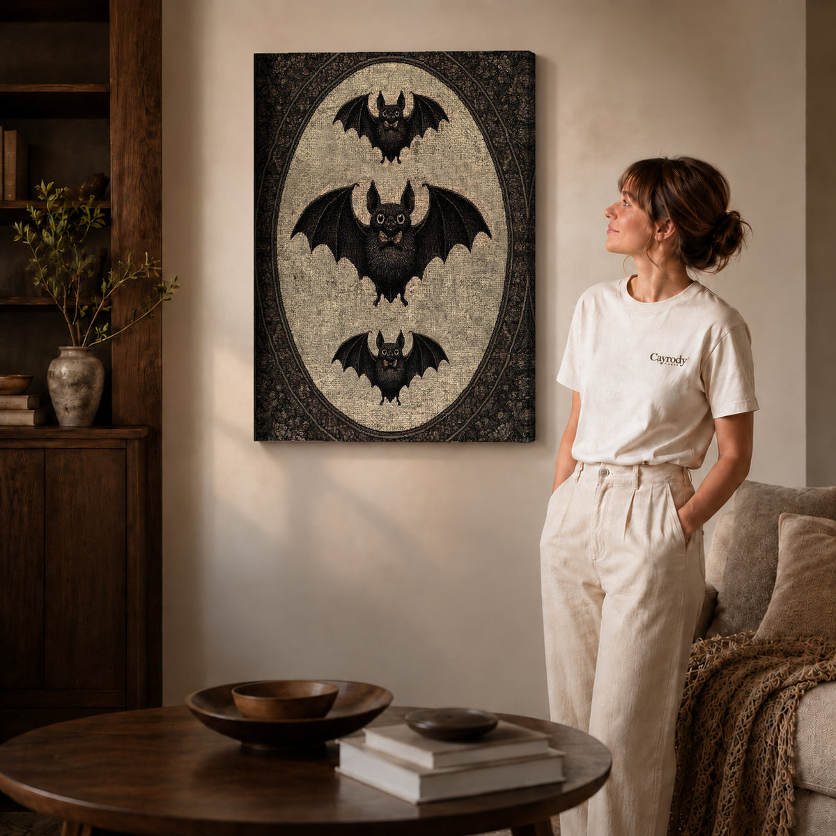 Vintage Bat canvas art displayed as gallery wrapped canvas beside a woman in natural light.