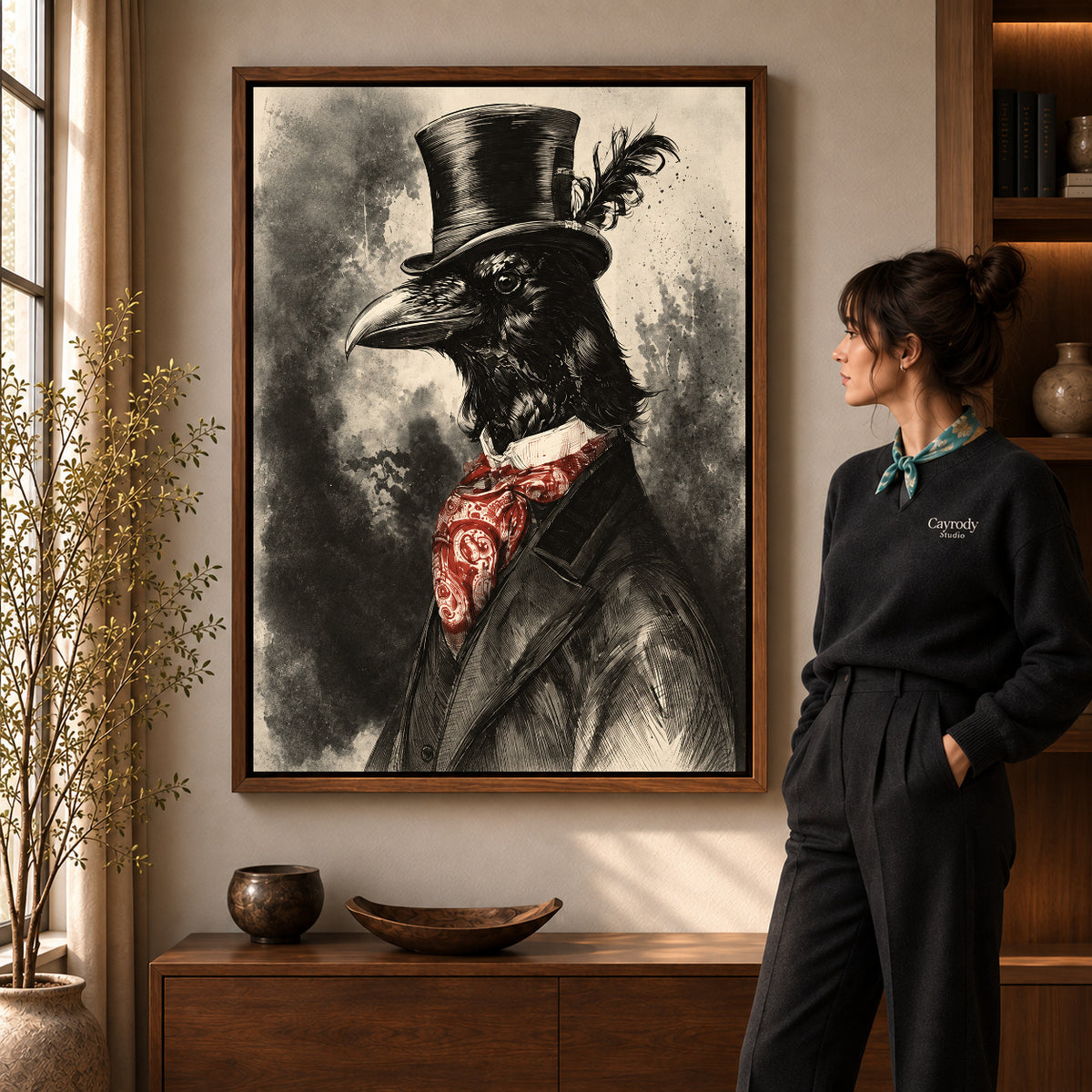 Walnut framed dapper raven canvas art shown beside a standing woman and a wooden console.