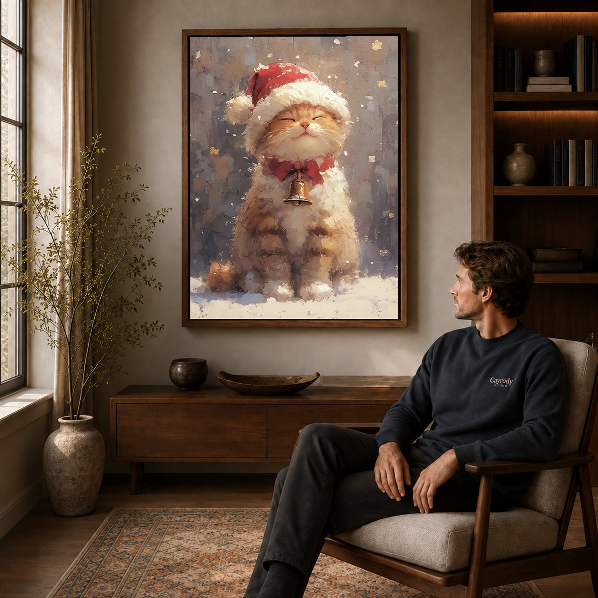 Santa Kitten canvas art above a wooden console beside a seated man in a warm room.