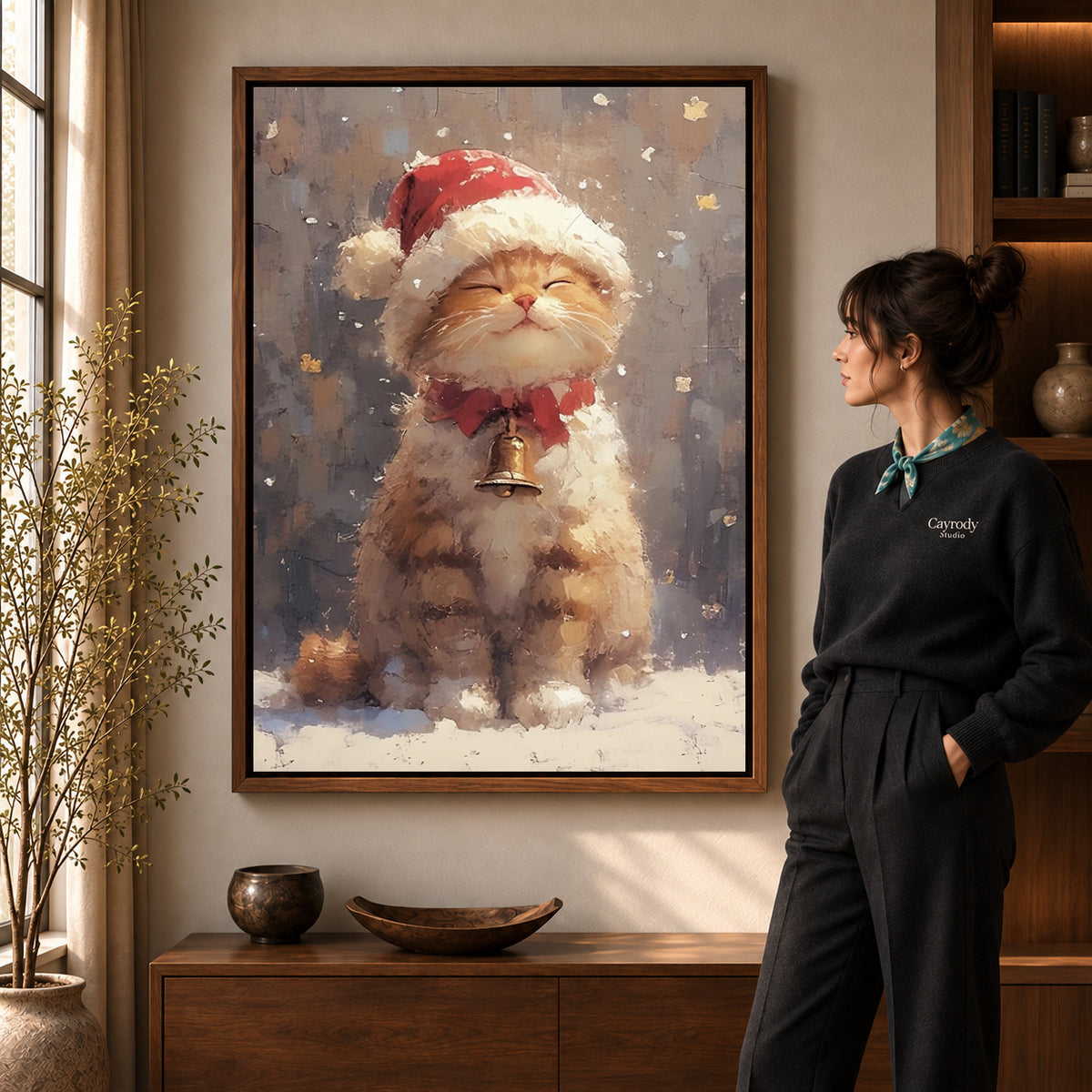 Walnut framed santa kitten canvas art shown beside a standing woman and a wooden console.