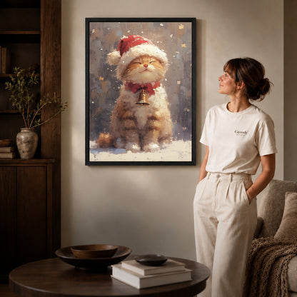 Black framed santa kitten canvas art displayed beside a woman in a warm living room.