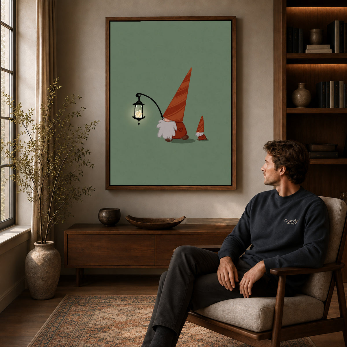 Lantern Gnomes canvas art above a wooden console beside a seated man in a warm room.
