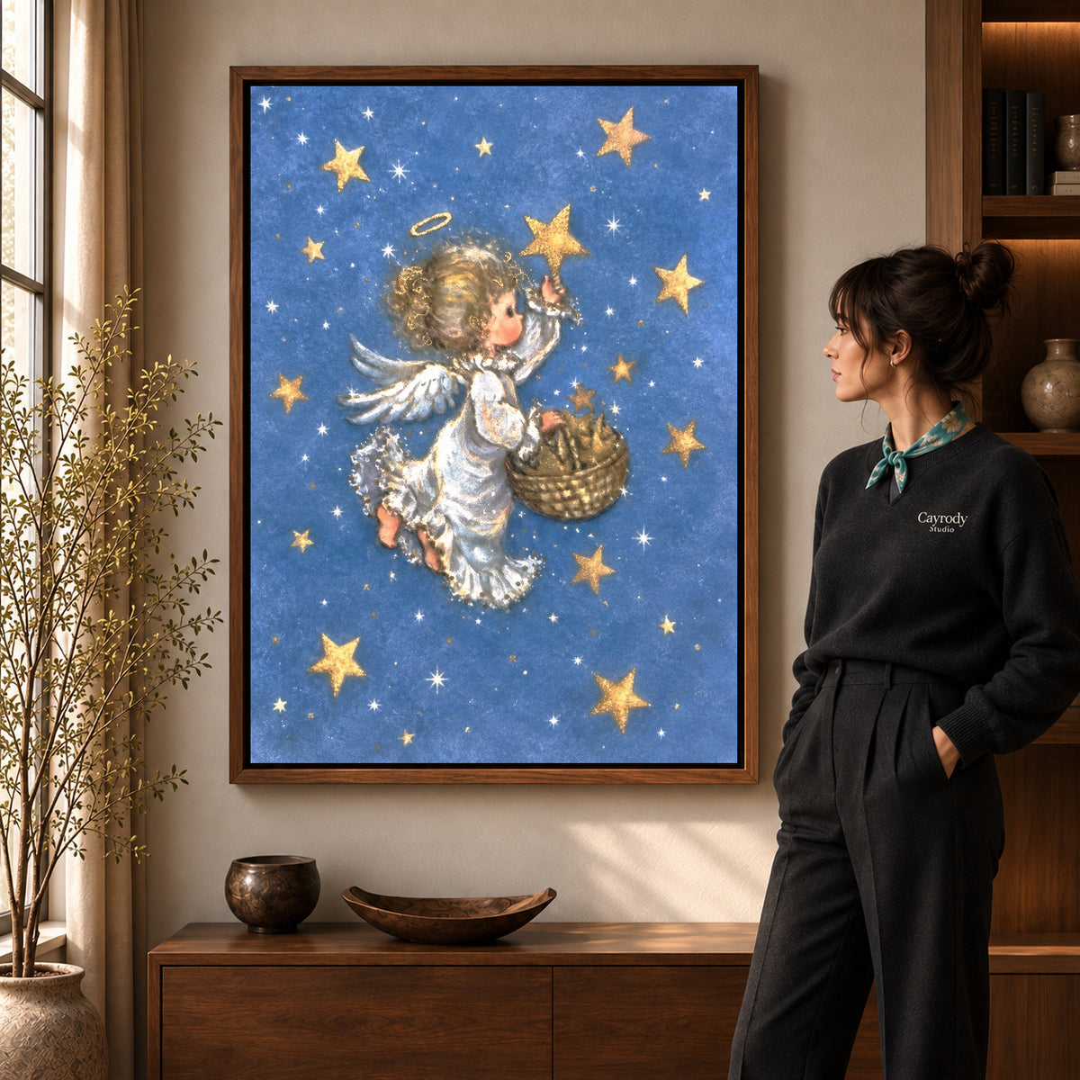 Walnut framed starlight angel canvas art shown beside a standing woman and a wooden console.
