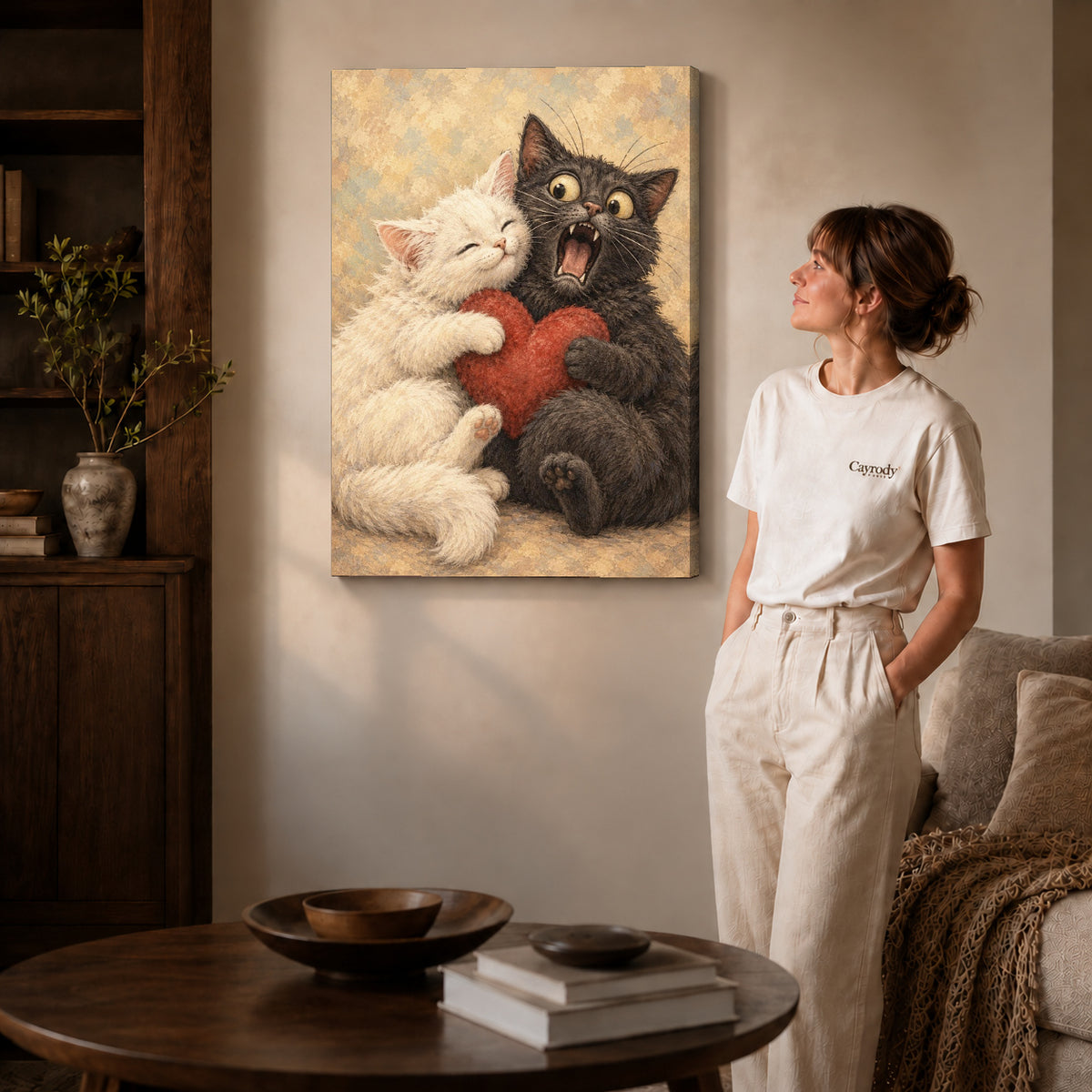 Gallery wrapped cat love canvas art with visible canvas edges beside a standing woman.