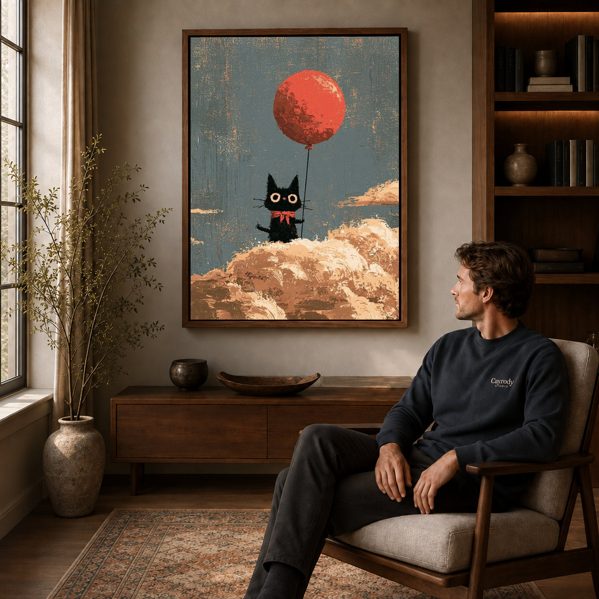 Cloud Cat canvas art above a wooden console beside a seated man in a warm room.