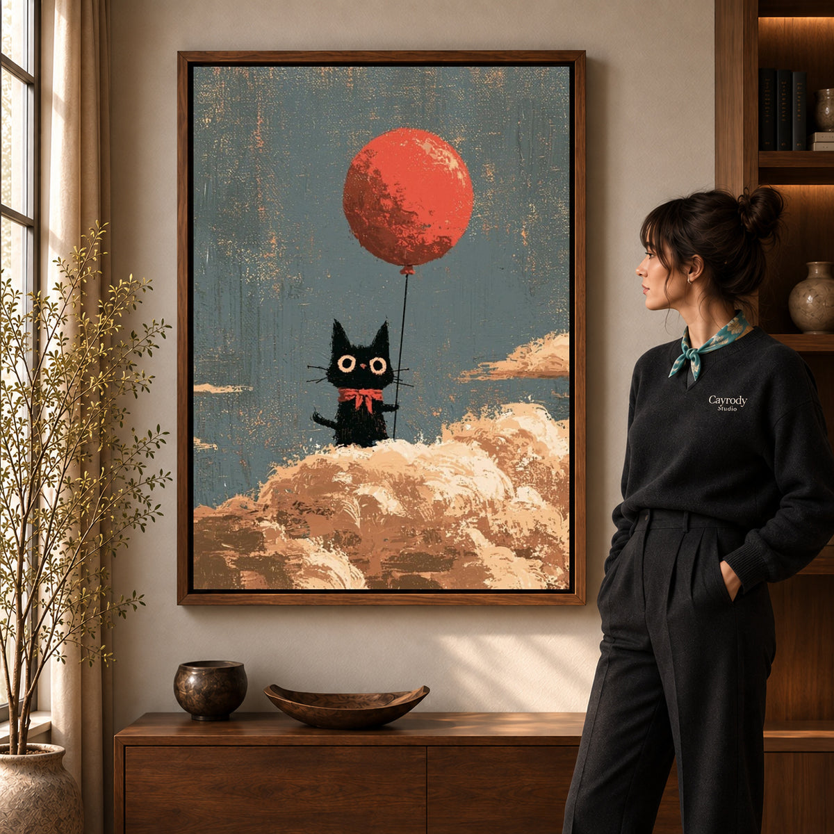 Walnut framed cloud cat canvas art shown beside a standing woman and a wooden console.