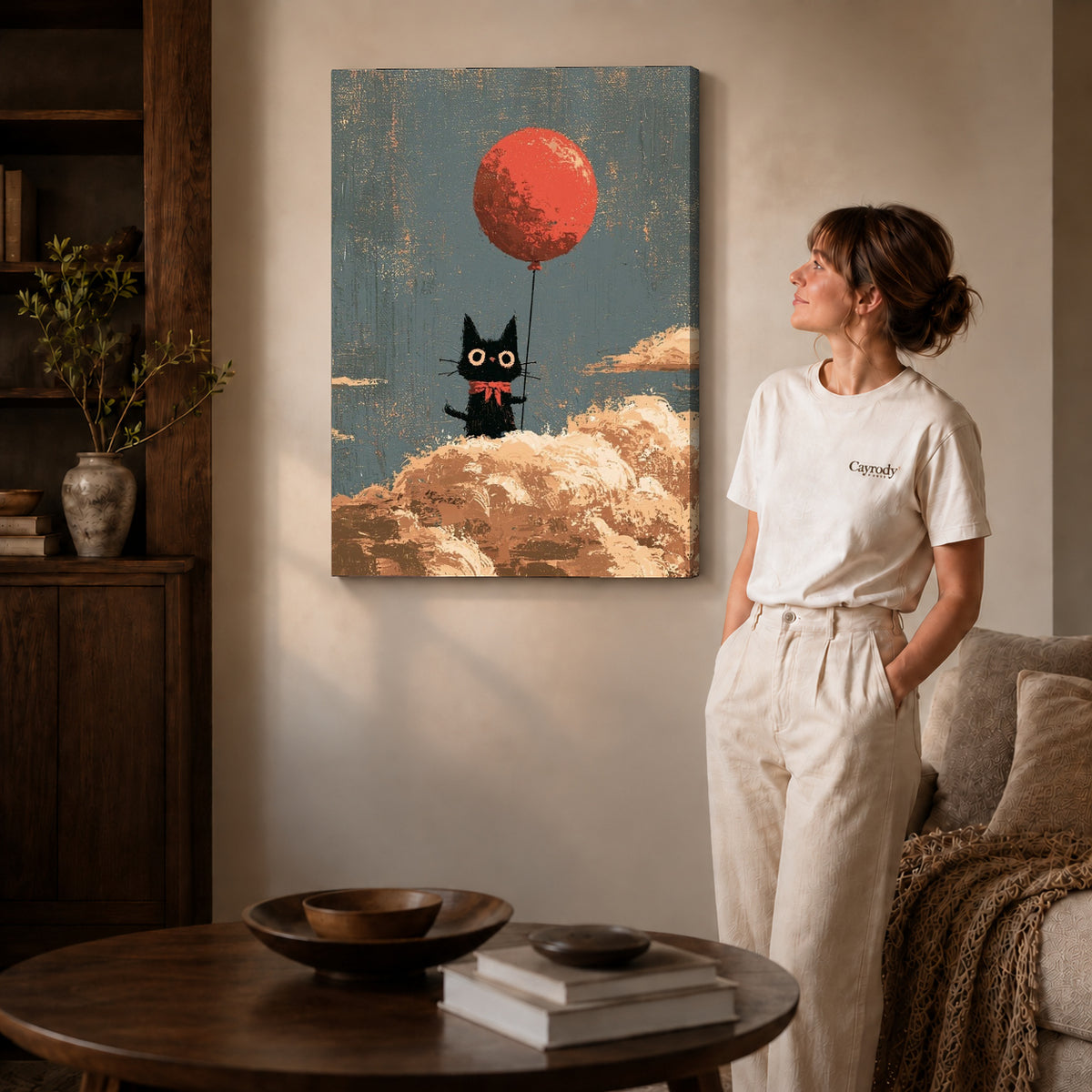 Gallery wrapped cloud cat canvas art with visible canvas edges beside a standing woman.