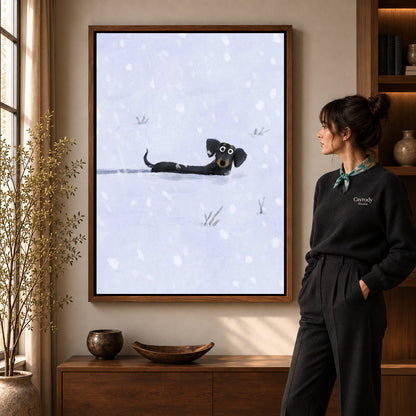 Snowy Dachshund canvas art in a walnut frame beside a standing woman and wooden console.