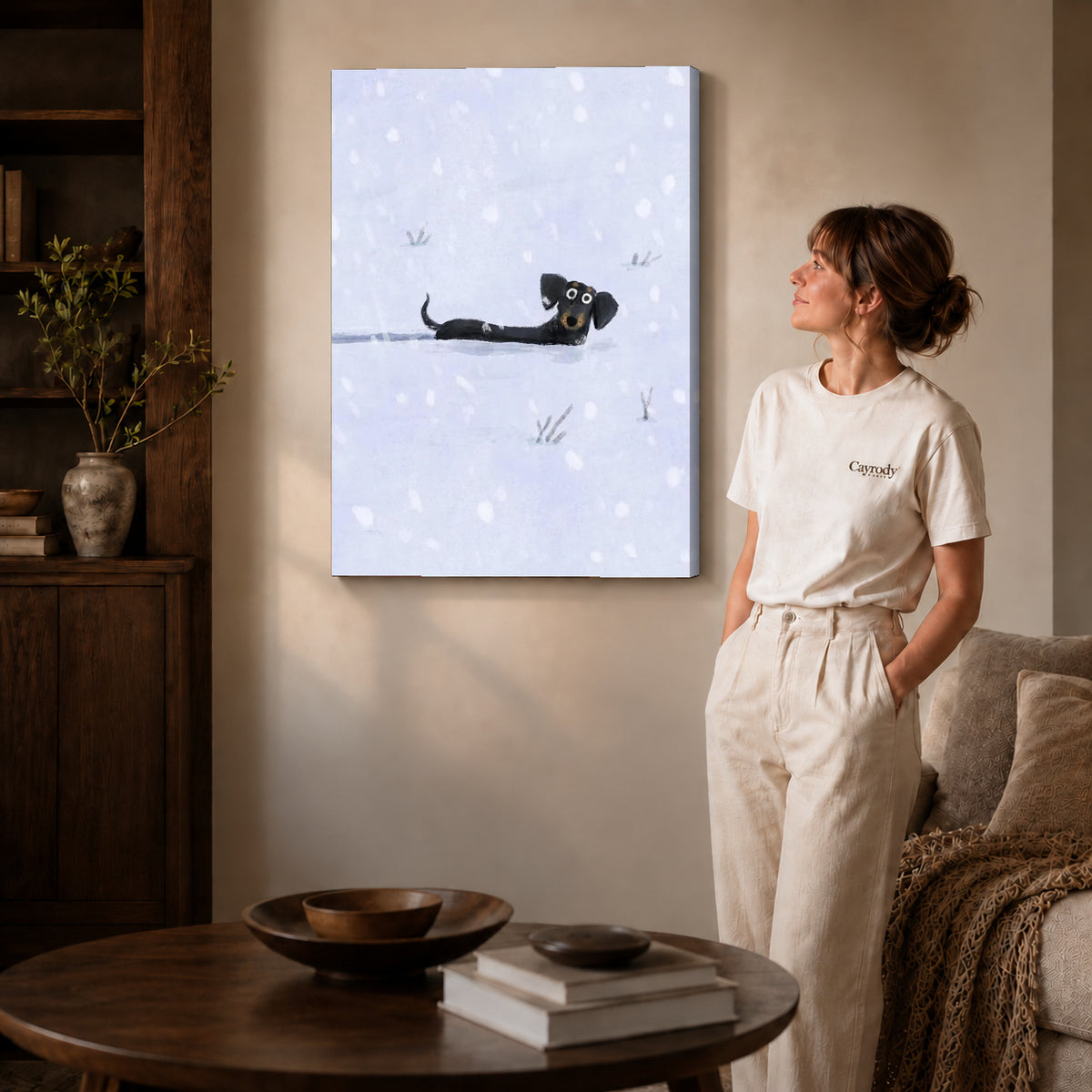 Snowy Dachshund canvas art displayed as gallery wrapped canvas beside a woman in natural light.