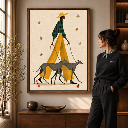 Stylish Greyhound Walk canvas art in a walnut frame beside a standing woman and wooden console.