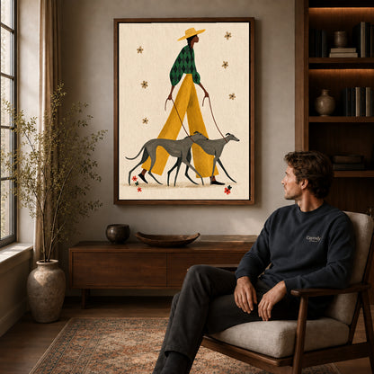 Stylish Greyhound Walk canvas art above a wooden console beside a seated man in a warm room.