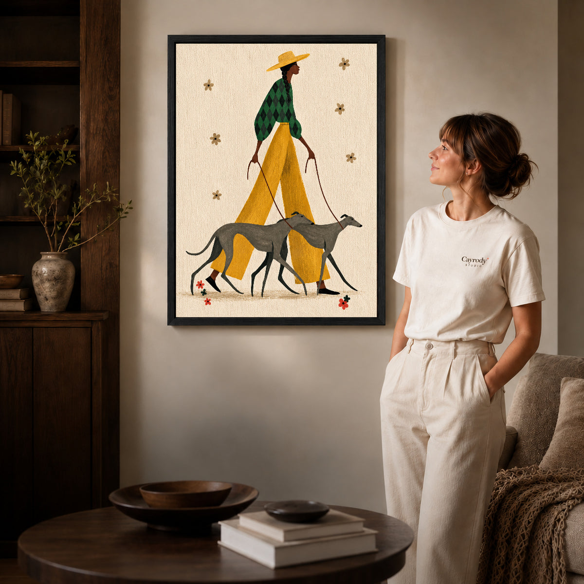 Stylish Greyhound Walk canvas art in a black frame above books in a welcoming living room.