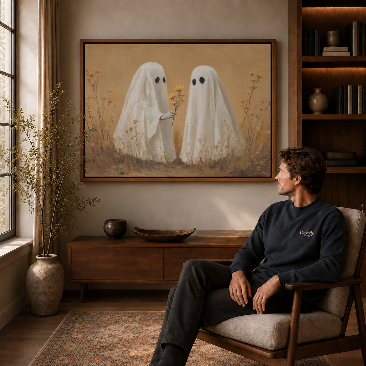 Ghost Flower Gift canvas art above a wooden console beside a seated man in a warm room.