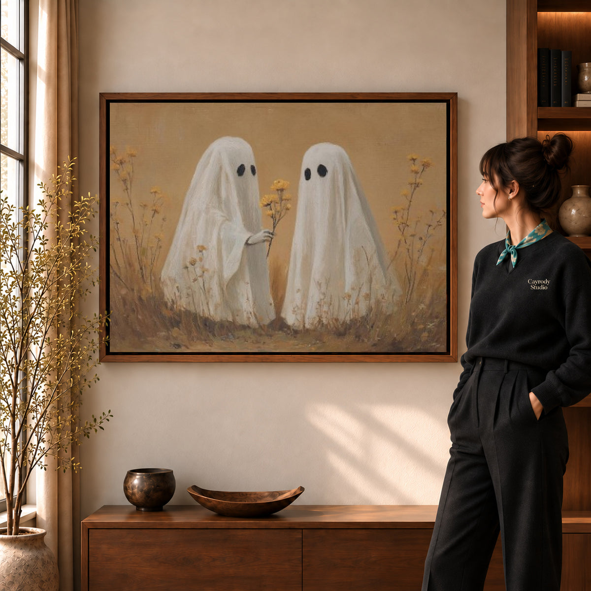 Walnut framed ghost flower gift canvas art shown beside a standing woman and a wooden console.