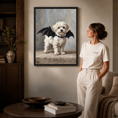 Black framed bat wing puppy canvas art displayed beside a woman in a warm living room.