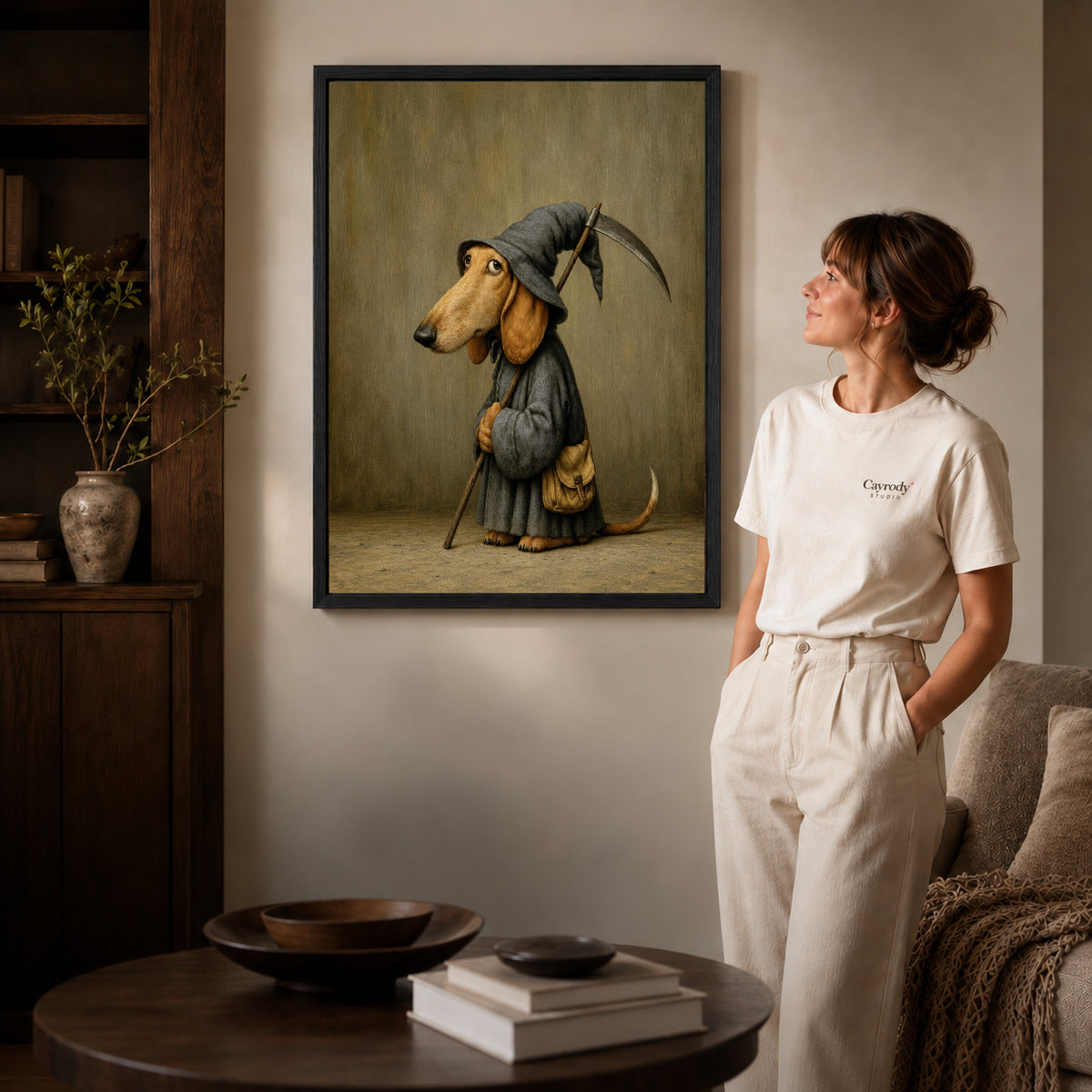 Reaper Dachshund canvas art in a black frame above books in a welcoming living room.