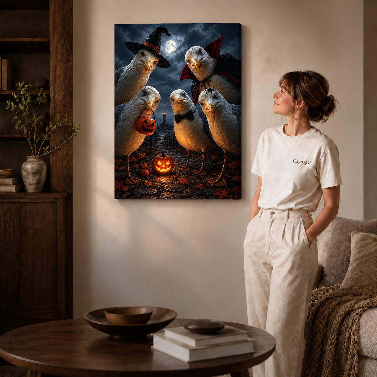 Gallery wrapped spooky seagull crew canvas art with visible canvas edges beside a standing woman.