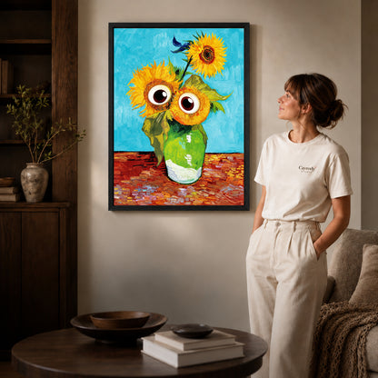 Black framed googly sunflowers canvas art displayed beside a woman in a warm living room.