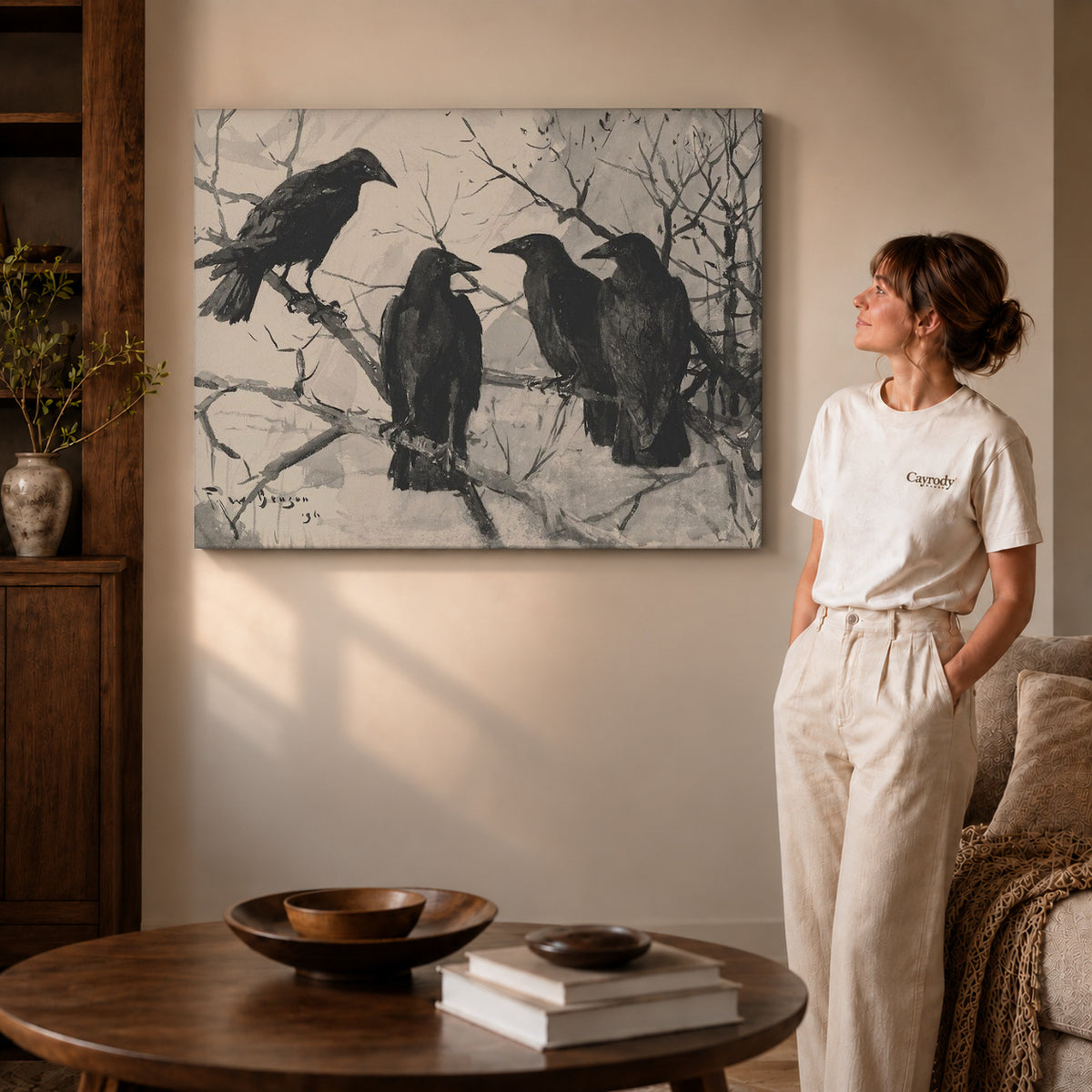 Gallery wrapped four ravens canvas art with visible canvas edges beside a standing woman.