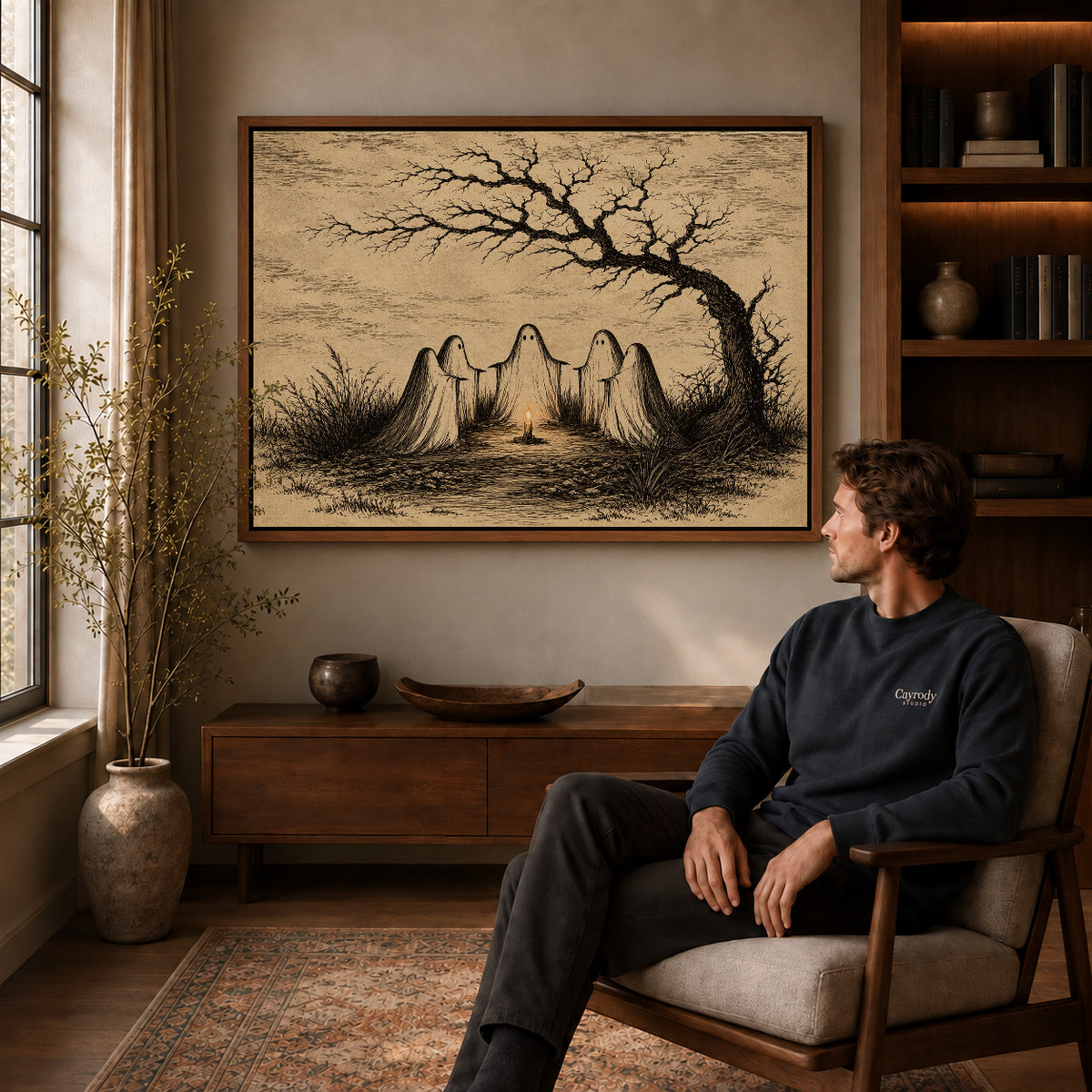 Candlelit Ghost Circle canvas art above a wooden console beside a seated man in a warm room.