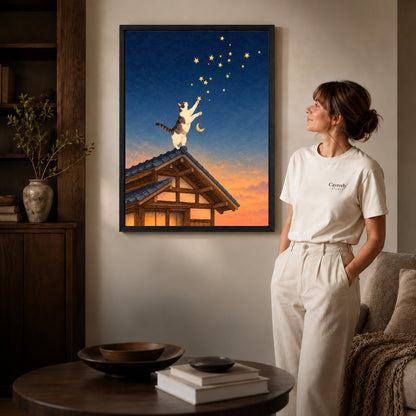 Stargazing Rooftop Cat canvas art in a black frame above books in a welcoming living room.