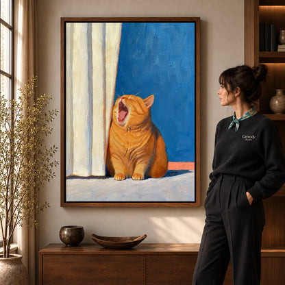 Yawning Orange Cat canvas art in a walnut frame beside a standing woman and wooden console.